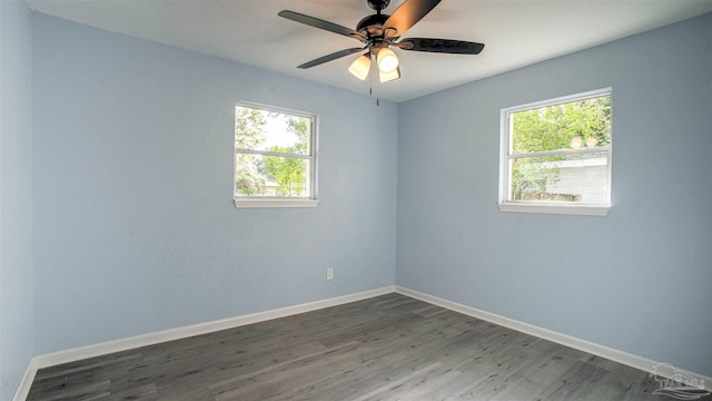 unfurnished room featuring dark hardwood / wood-style floors and ceiling fan