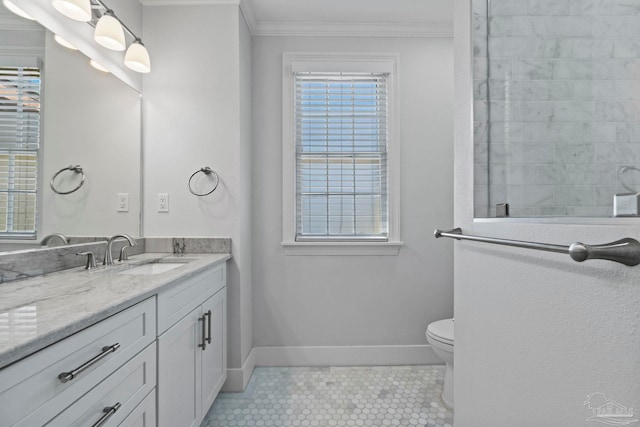 bathroom with tile patterned flooring, toilet, vanity, baseboards, and ornamental molding