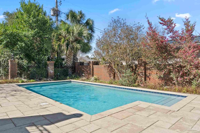 view of pool featuring a fenced in pool, fence, and a patio