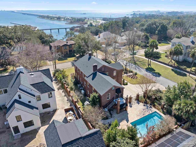 birds eye view of property with a water view and a residential view