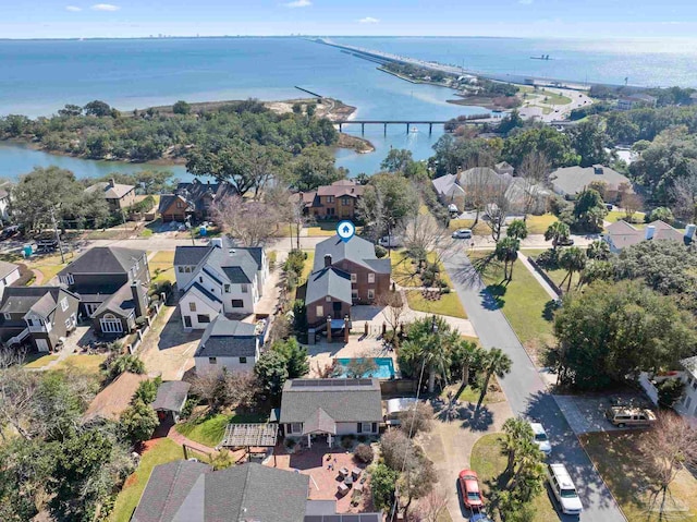 drone / aerial view with a water view and a residential view