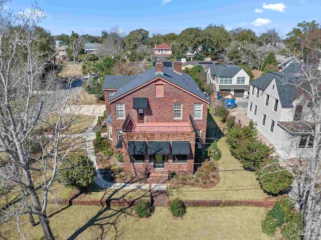 birds eye view of property with a residential view