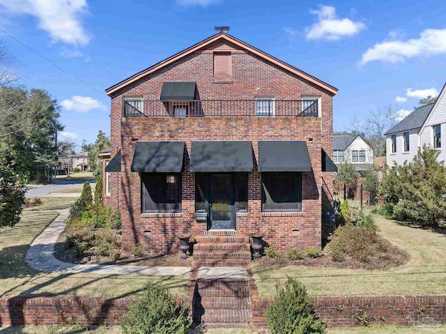 view of front of property featuring brick siding