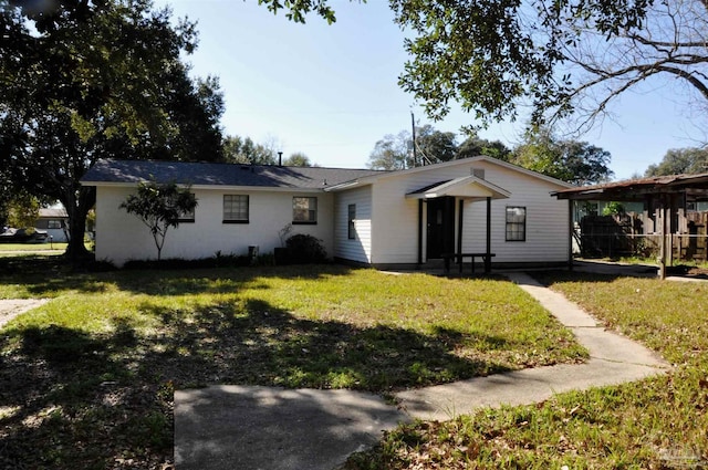 ranch-style house with a front lawn