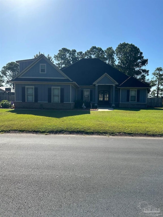 ranch-style house featuring a front lawn