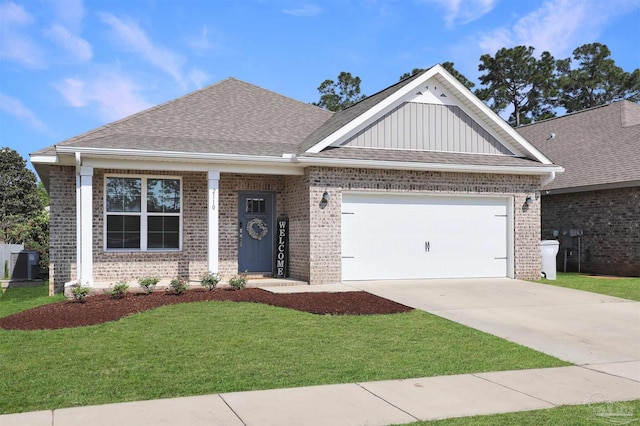 view of front of house with board and batten siding, brick siding, a front yard, and a garage