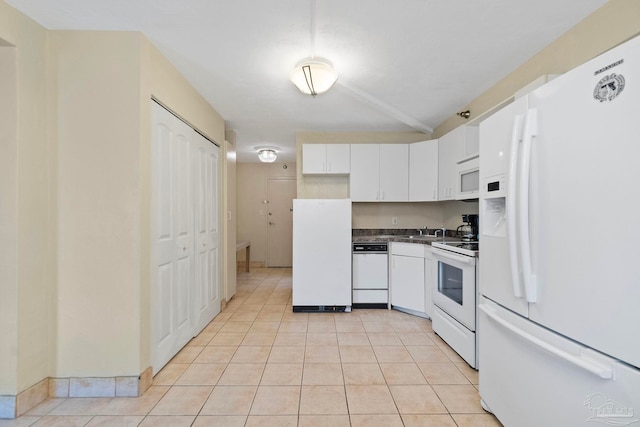 kitchen featuring white cabinetry, white appliances, and light tile patterned floors