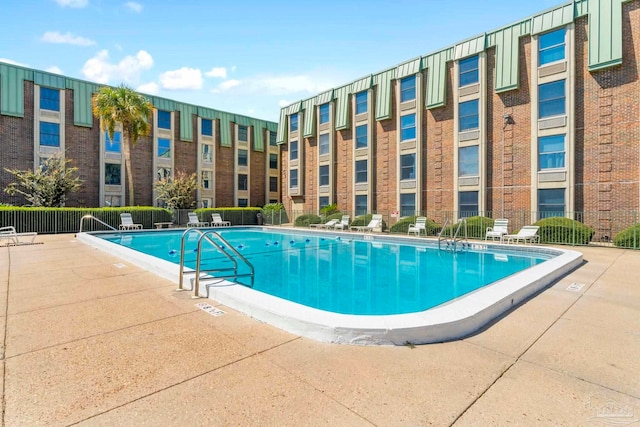 view of swimming pool featuring a patio