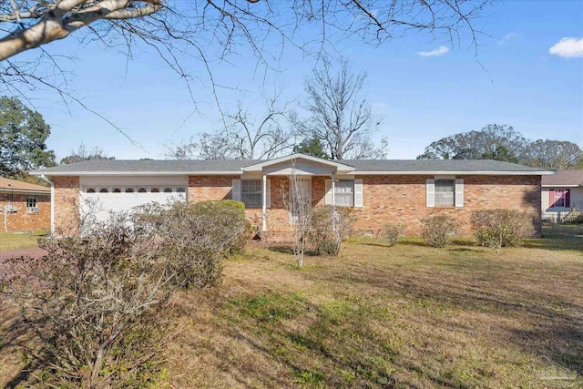 ranch-style house featuring a garage and a front yard