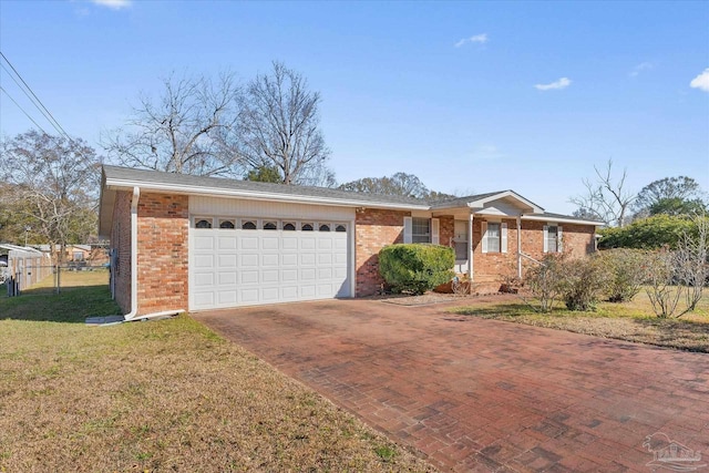 ranch-style home featuring a garage and a front yard