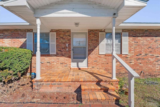 property entrance featuring a porch