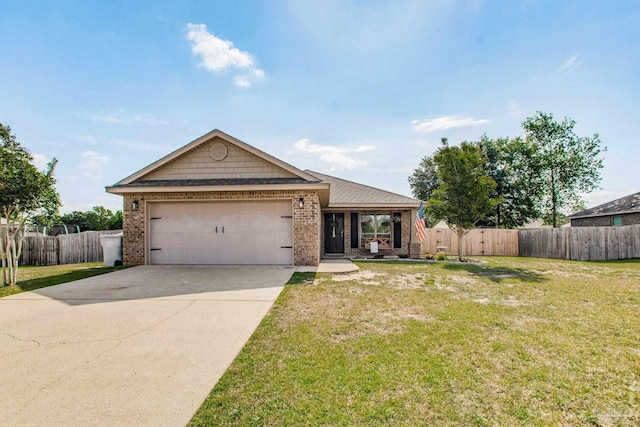 single story home with a garage, fence, a front yard, brick siding, and concrete driveway