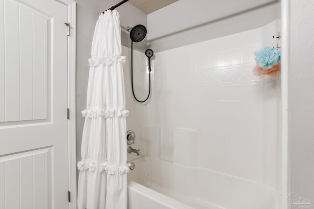 bathroom with shower / tub combo with curtain