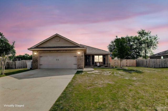 single story home with a garage, fence, driveway, and a front yard