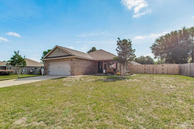 ranch-style home with fence, an attached garage, a front lawn, brick siding, and driveway