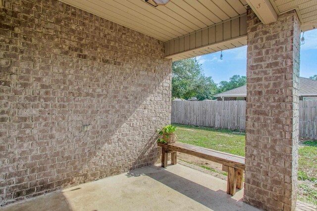 view of patio / terrace featuring fence