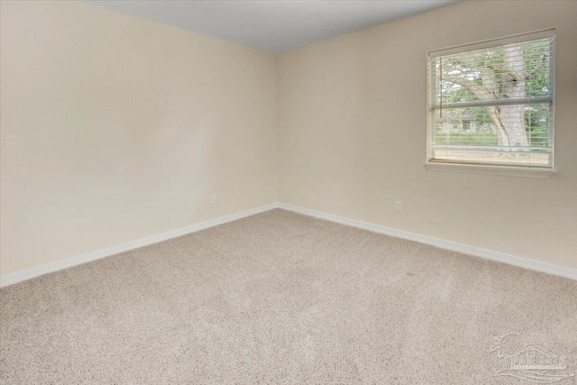 4670 Durham Dr, Pensacola, FL 32526 - spare room featuring carpet flooring and baseboards