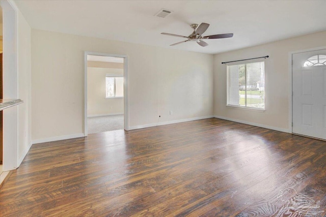 4670 Durham Dr, Pensacola, FL 32526 - unfurnished living room featuring plenty of natural light, a ceiling fan, wood finished floors, and baseboards