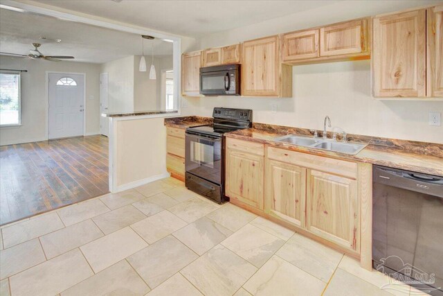 4670 Durham Dr, Pensacola, FL 32526 - kitchen featuring black appliances, light brown cabinets, a sink, a ceiling fan, and open floor plan