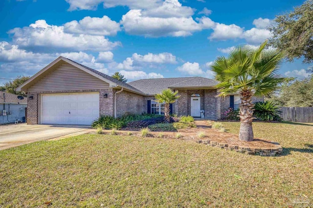 single story home with a garage and a front lawn