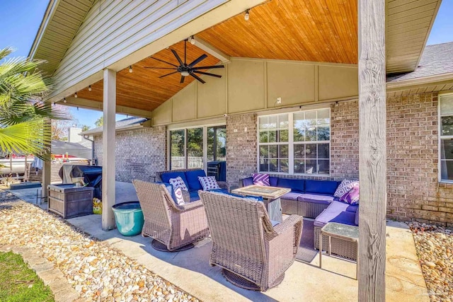 view of patio with an outdoor living space and ceiling fan