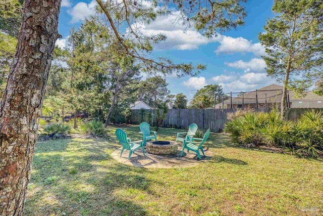 view of yard with an outdoor fire pit