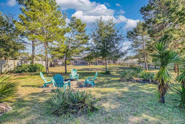 view of yard with a fire pit