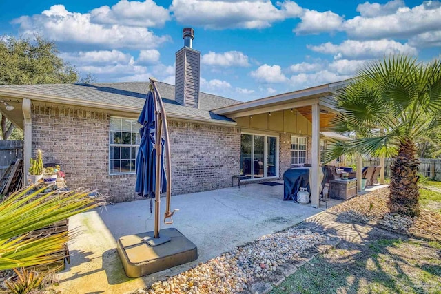 back of property featuring a patio area