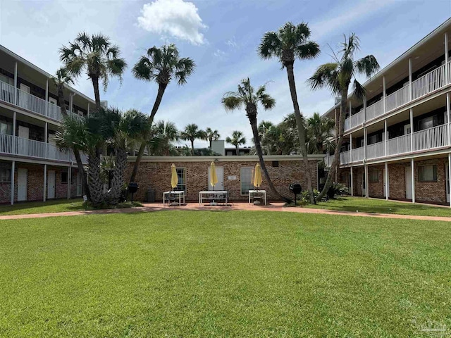 view of community featuring a yard