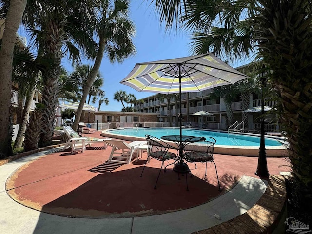 community pool featuring a patio