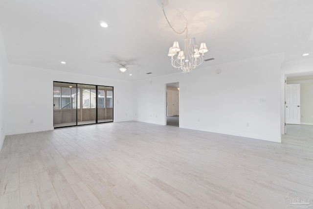 spare room with recessed lighting, light wood-type flooring, baseboards, and ceiling fan with notable chandelier