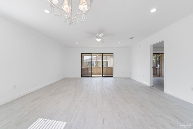 unfurnished room featuring recessed lighting, baseboards, light wood-style floors, and ceiling fan with notable chandelier