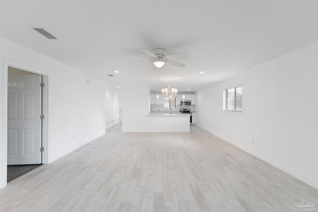 unfurnished living room with baseboards, light wood finished floors, a sink, ornamental molding, and ceiling fan with notable chandelier