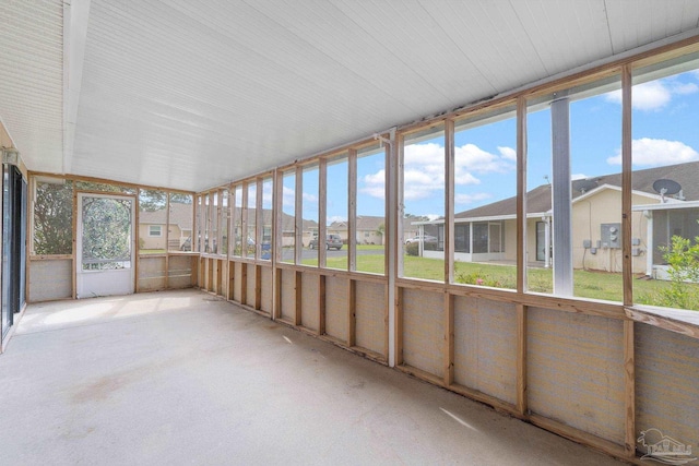 unfurnished sunroom with a residential view