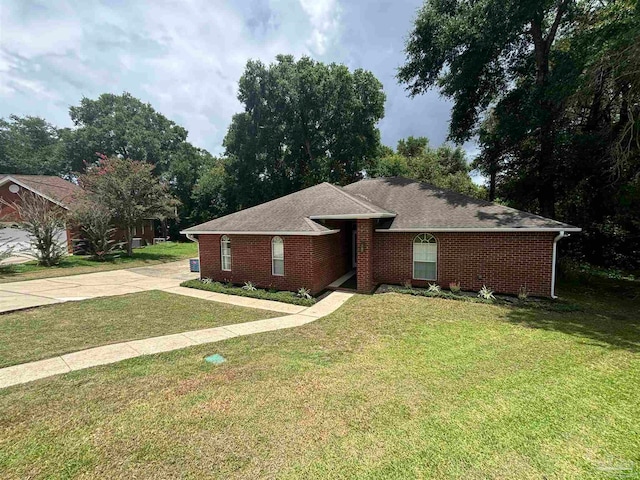 ranch-style home featuring a front yard