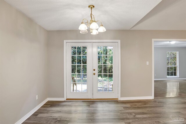 unfurnished room with dark wood-type flooring, a textured ceiling, and ceiling fan