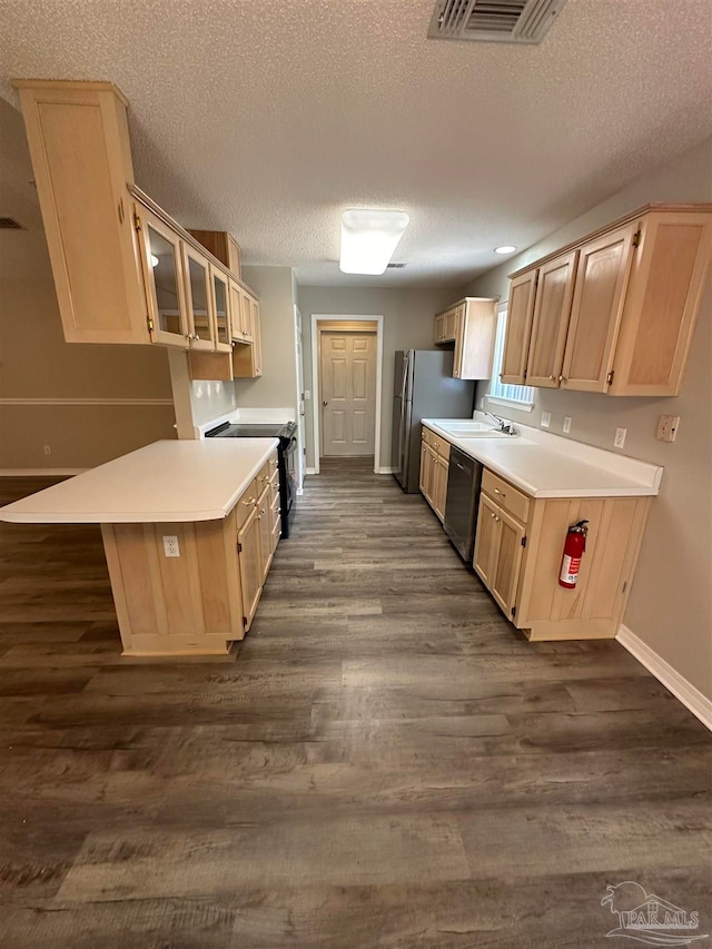 kitchen with light brown cabinetry, dishwasher, electric range, dark hardwood / wood-style flooring, and stainless steel fridge