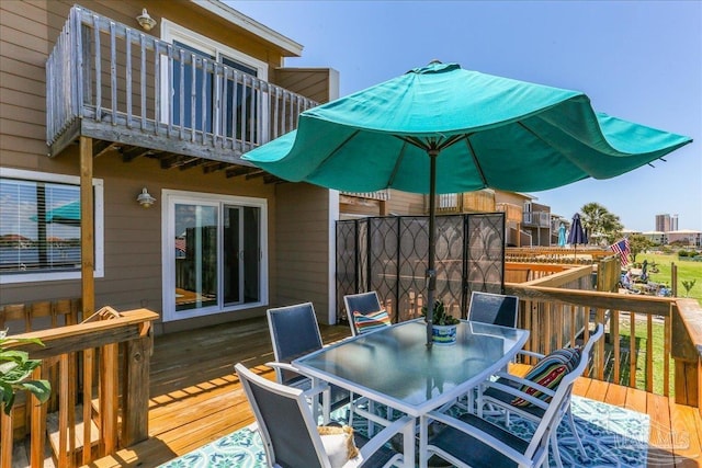 342 Ft Pickens Rd, Pensacola Beach, FL 32561 - wooden terrace with outdoor dining area