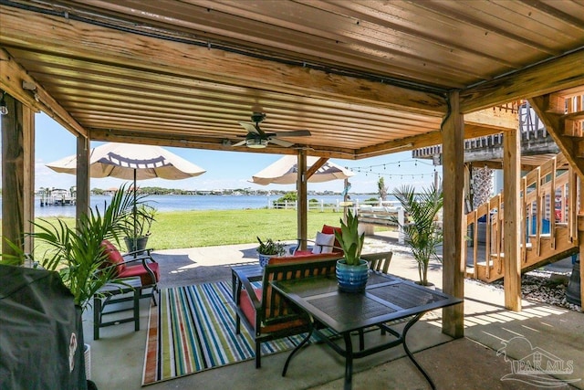 342 Ft Pickens Rd, Pensacola Beach, FL 32561 - view of patio / terrace with a water view, ceiling fan, and stairs
