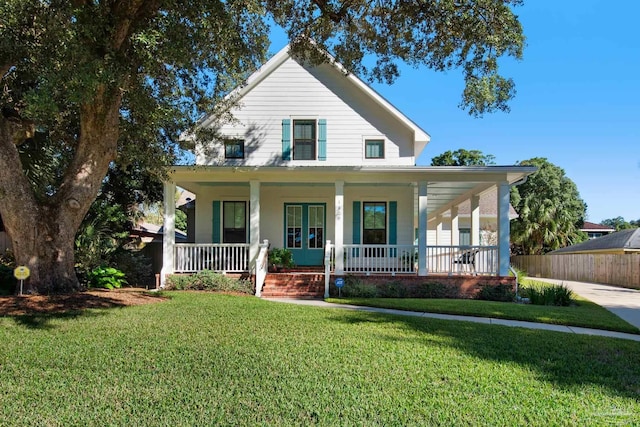 farmhouse-style home with a porch and a front yard