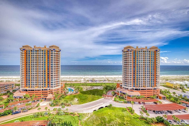 birds eye view of property featuring a water view and a view of the beach