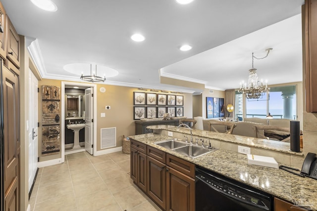 kitchen featuring black dishwasher, a notable chandelier, hanging light fixtures, open floor plan, and a sink