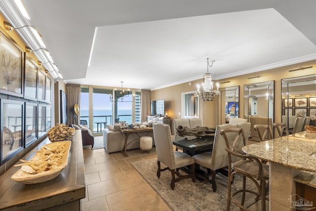 dining room featuring an inviting chandelier, light tile patterned floors, and crown molding