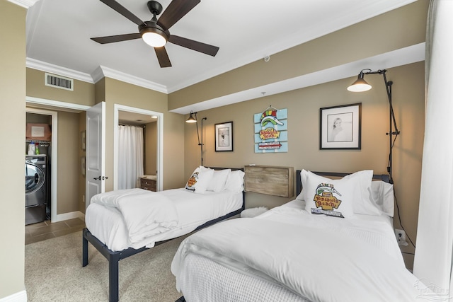 bedroom featuring washer / dryer, visible vents, baseboards, ceiling fan, and crown molding