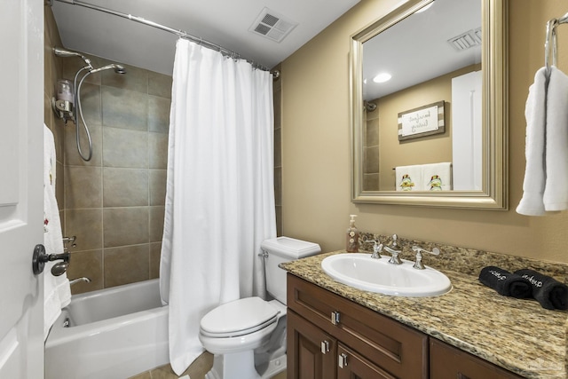 full bathroom featuring toilet, vanity, visible vents, and shower / bathtub combination with curtain