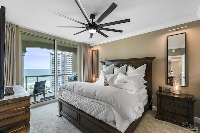 bedroom featuring access to exterior, floor to ceiling windows, crown molding, a water view, and light carpet