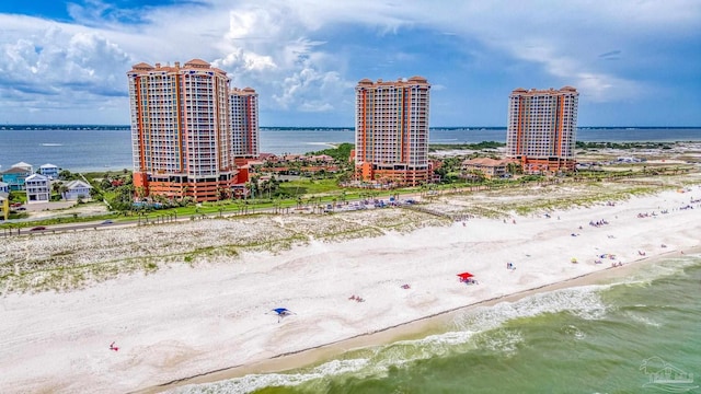 bird's eye view featuring a view of the beach, a water view, and a city view