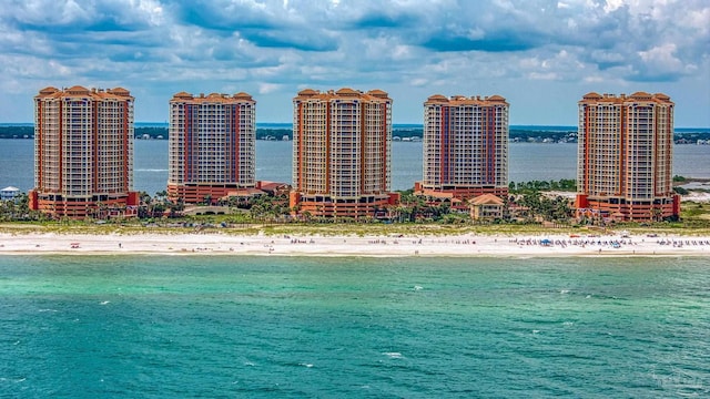 drone / aerial view featuring a view of the beach and a water view
