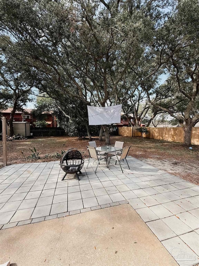 view of patio / terrace featuring a fire pit