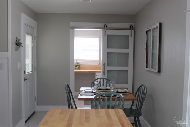 30 Woodham Ave, Ft Walton Beach, FL 32547 - dining room with baseboards and healthy amount of natural light